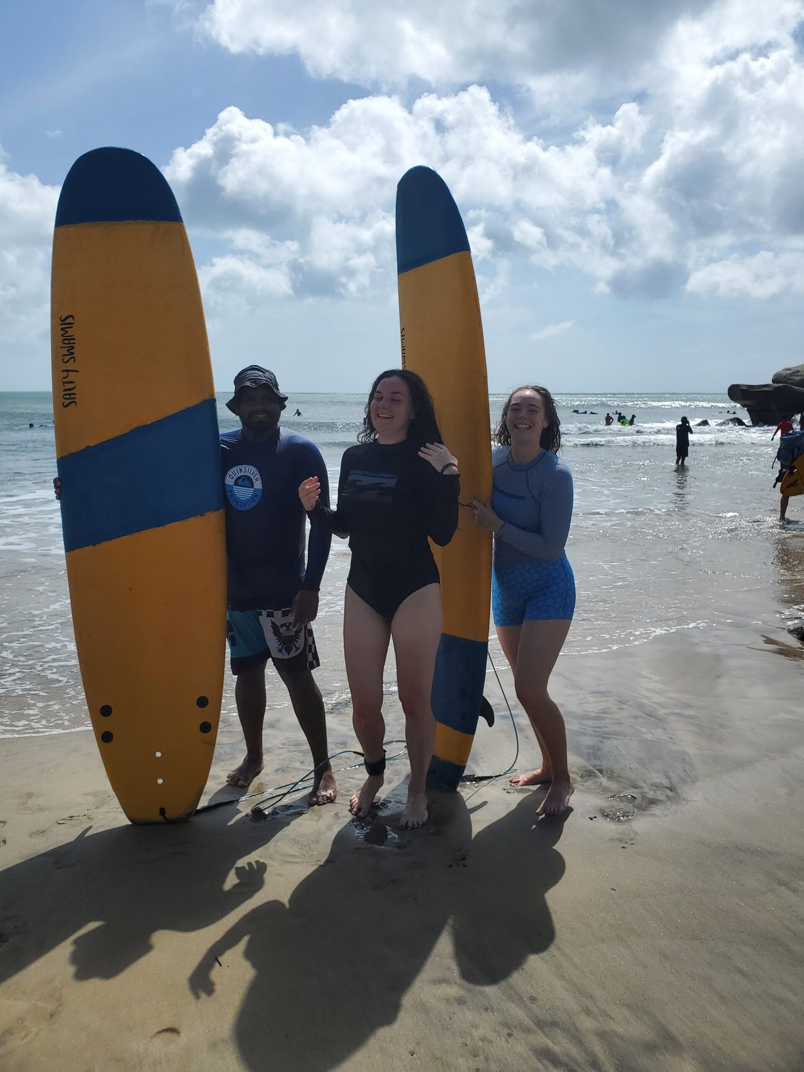 “Surf instructor helping student catch a wave Arugam Bay”